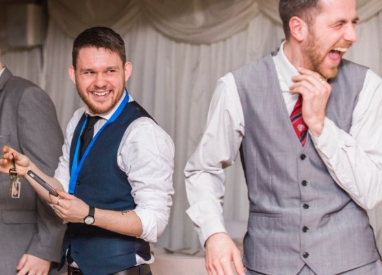 Greg Holroyd holds the keys mid-trick as wedding guests burst into uncontrollable laughter during a mind-blowing magic routine.