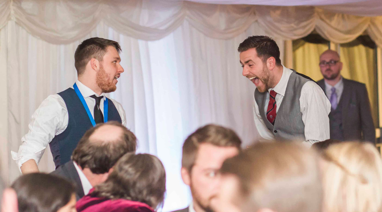 Wedding guest shouts in disbelief as Greg Holroyd pulls off an impossible trick mid-performance under a marquee tent.