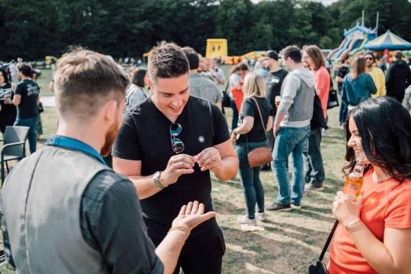 Corporate magician performing interactive magic during a company celebration