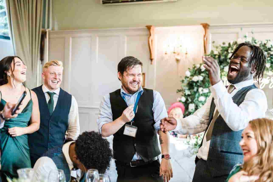 Wedding guests having fun with magician Greg Holroyd